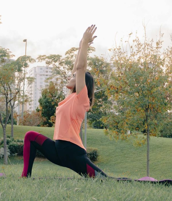 A woman in a serene yoga pose, embodying balance and flexibility.